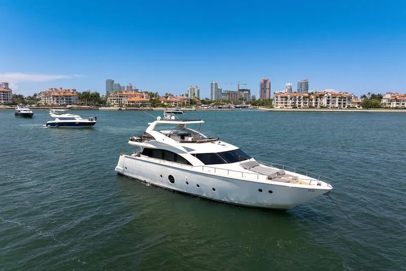 Slide: The Image of Luxury 2008 Aicon 75 yacht anchored in scenic coastal waters. - 3