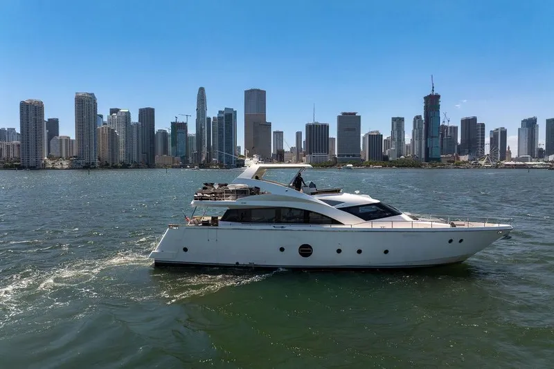 Slide: The Image of Luxury Aicon 75 yacht cruising near a city skyline, 2008 model. - 5
