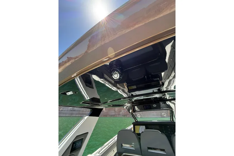 Slide: The Image of 2024 Cigarette 42' Auroris boat interior with sleek design and modern features under sunlight. - 21