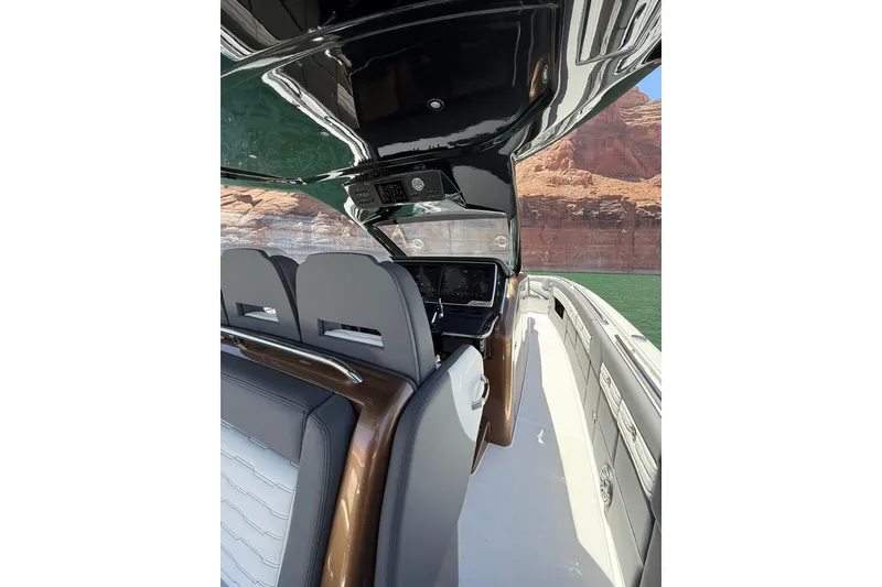 Slide: The Image of 2024 Cigarette 42' Auroris luxury boat interior with sleek design and advanced controls. - 29