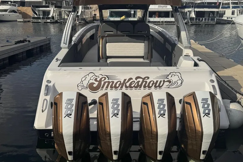 Slide: The Image of 2024 Cigarette 42' Auroris boat with four powerful 500R engines docked at marina. - 3