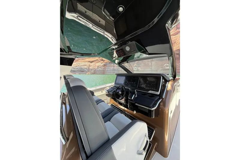Slide: The Image of Interior view of 2024 Cigarette 42' Auroris boat cockpit with modern controls. - 30