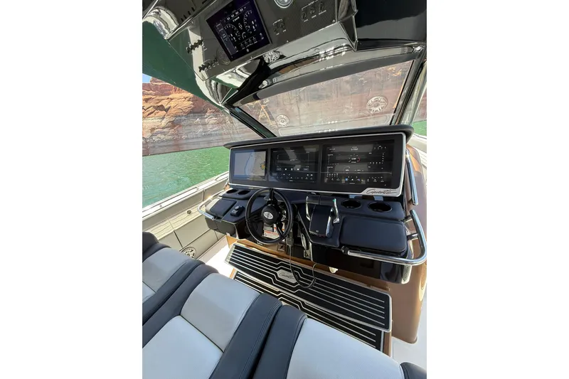 Slide: The Image of 2024 Cigarette 42' Auroris boat cockpit with advanced navigation system and luxurious seating. - 31