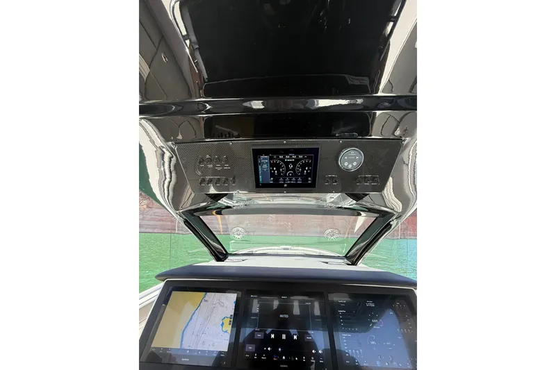 Slide: The Image of Interior dashboard of 2024 Cigarette 42' Auroris boat with advanced navigation displays. - 36