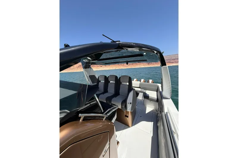 Slide: The Image of 2024 Cigarette 42' Auroris boat interior with sleek seating on a sunny day. - 37