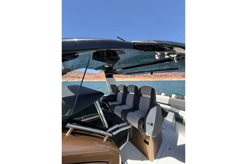 Slide: The Image of 2024 Cigarette 42' Auroris luxury boat interior with sleek seating and modern design on a sunny day. - 38