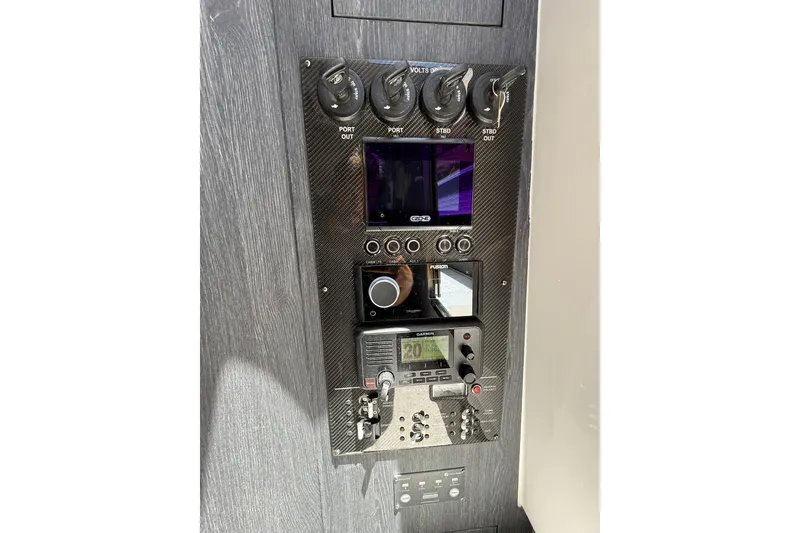Slide: The Image of Control panel of 2024 Cigarette 42' Auroris boat with advanced navigation and audio systems. - 57