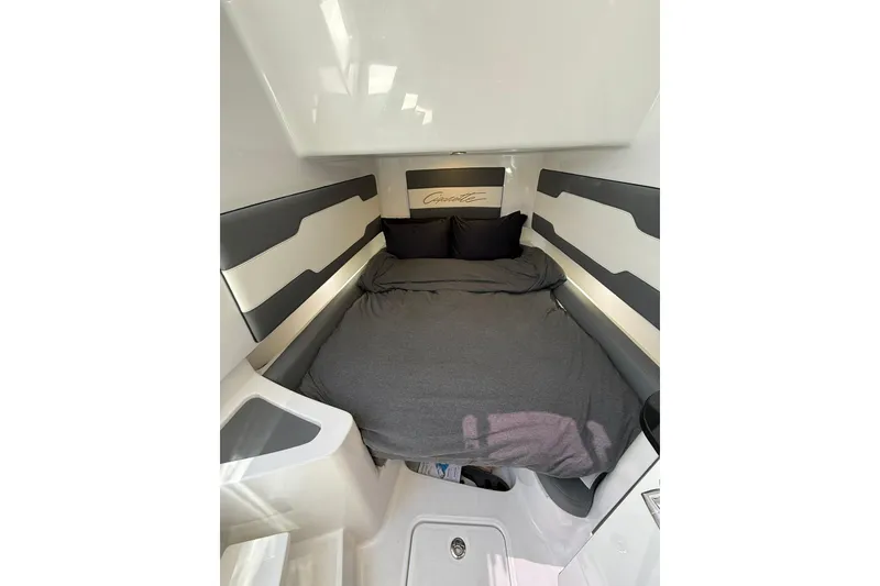 Slide: The Image of 2024 Cigarette 42' Auroris cabin interior with cozy bed and modern design. - 60