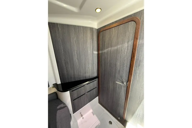 Slide: The Image of Interior of 2024 Cigarette 42' Auroris boat, featuring sleek wood paneling and modern design. - 61