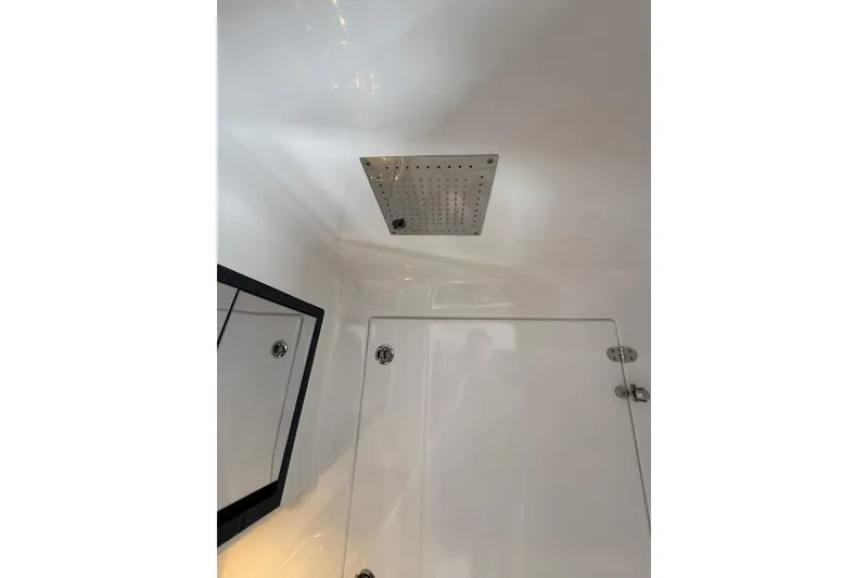 Slide: The Image of Interior of 2024 Cigarette 42' Auroris boat, featuring a sleek shower area. - 63