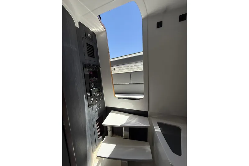 Slide: The Image of Interior view of 2024 Cigarette 42' Auroris yacht, featuring modern control panel and sleek design. - 64