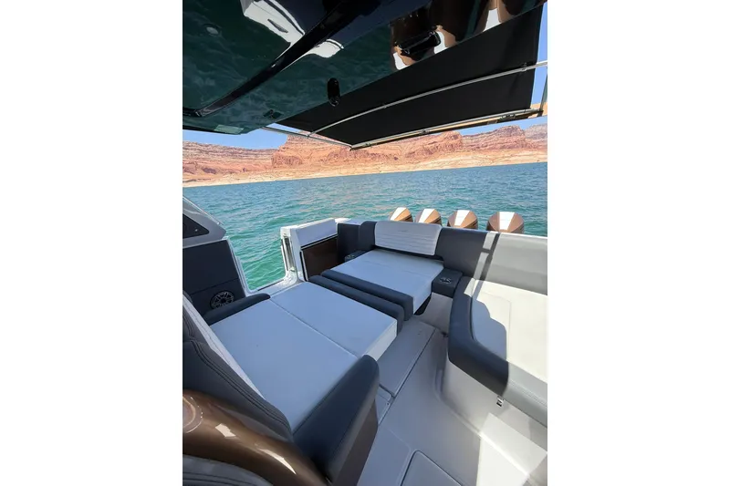 Slide: The Image of 2024 Cigarette 42' Auroris luxury boat interior with scenic lake and canyon view. - 69