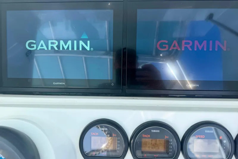 Slide: The Image of Garmin displays and Yamaha gauges on a 2000 Contender 35 Side Console boat. - 12