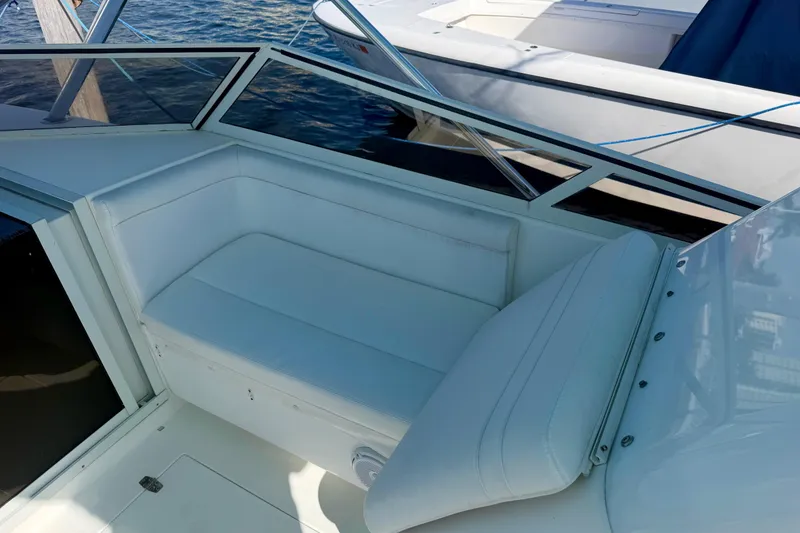Slide: The Image of White seating area on a 2000 Contender 35 Side Console boat. - 5