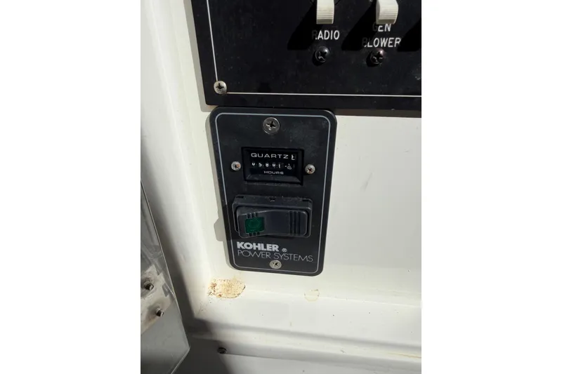 Slide: The Image of Kohler power systems panel on 2000 Contender 35 Side Console boat. - 7