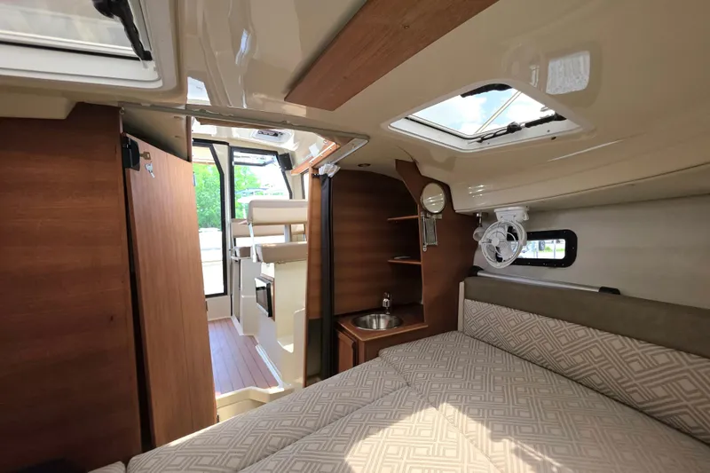 Slide: The Image of Interior of 2021 Ranger Tugs R-23 boat with cozy cabin and modern amenities. - 11