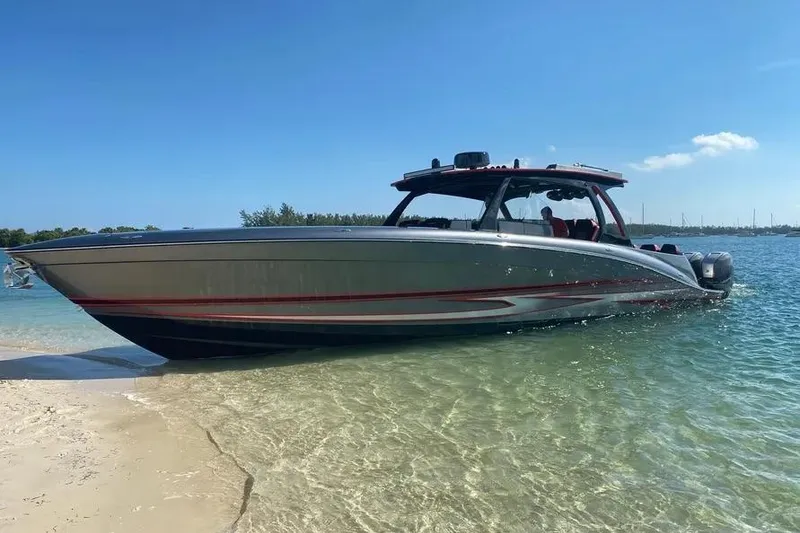 Slide: The Image of 2021 Concept 44' Open Deck boat on a sunny beach shoreline. - 11