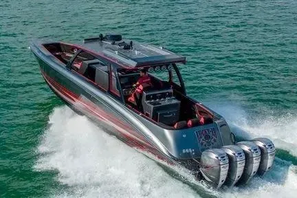 Slide: The Image of 2021 Concept 44' Open Deck boat cruising on water with four powerful engines. - 12