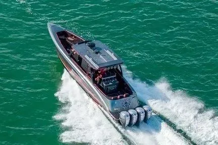 Slide: The Image of Concept 44' Open Deck 2021 boat cruising on open water with powerful engines. - 13