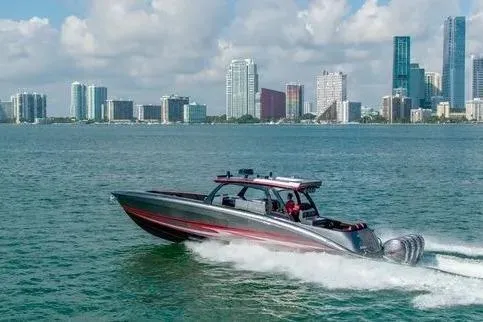 Slide: The Image of 2021 Concept 44' Open Deck boat cruising near city skyline. - 40