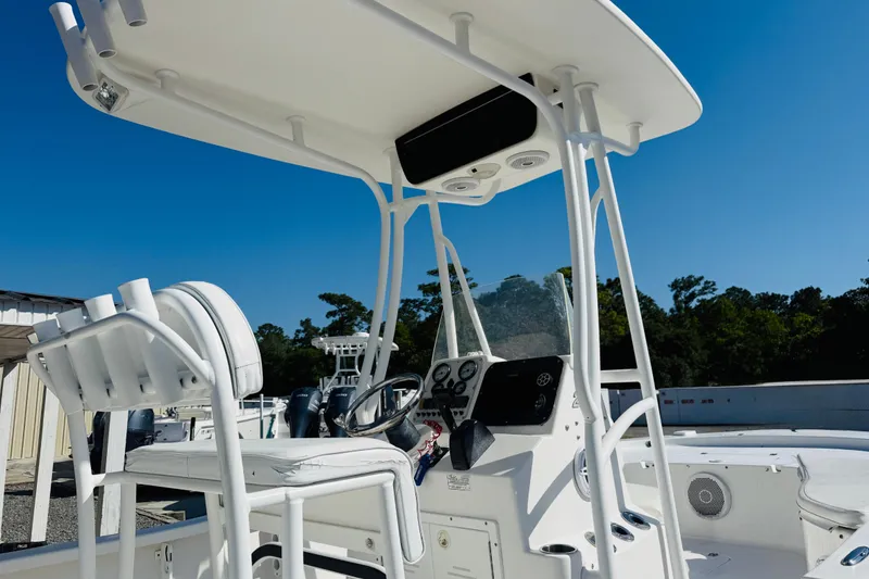 Slide: The Image of 2012 Tidewater 2200 Carolina Bay boat interior with steering console and seating. - 4
