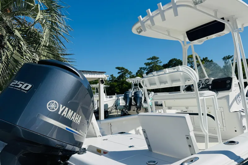 Slide: The Image of 2012 Tidewater 2200 Carolina Bay boat with Yamaha 250 engine, under clear blue sky. - 6