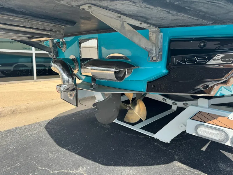 Slide: The Image of Underside of a 2019 Nautique G25 boat with propeller and NSS Waveplate. - 4