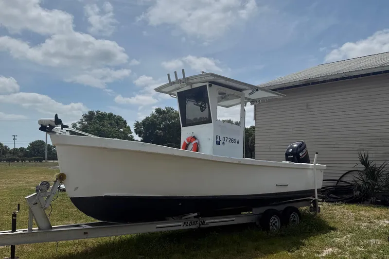 Slide: The Image of 1956 Custom Mackerel boat on trailer, sunny day. - 2