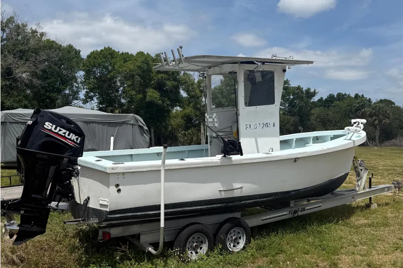 Slide: The Image of 1956 Custom Mackerel boat with Suzuki engine on trailer. - 3