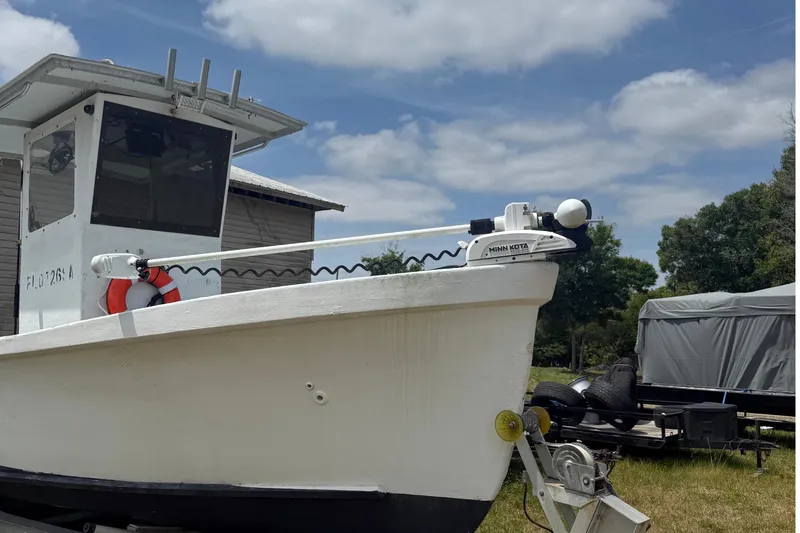 Slide: The Image of White 1956 Custom Mackerel boat with Minn Kota motor. - 4