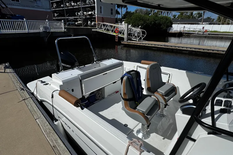 Slide: The Image of 2024 Beneteau Flyer 8 SPACEdeck boat docked, featuring modern seating and controls. - 3
