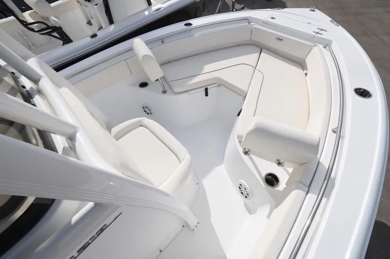 Slide: The Image of 2026 Sea Hunt Ultra 219 boat interior with white seating and modern design. - 3