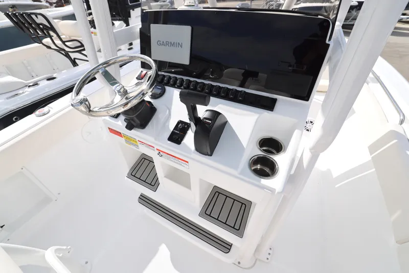 Slide: The Image of 2026 Sea Hunt Ultra 219 boat console with Garmin display and steering wheel. - 4