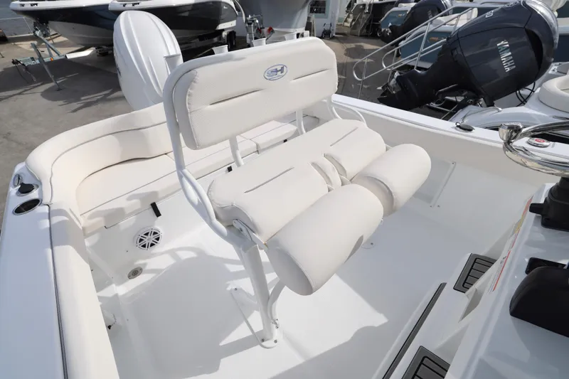 Slide: The Image of 2026 Sea Hunt Ultra 219 boat interior with white seating and modern design. - 7