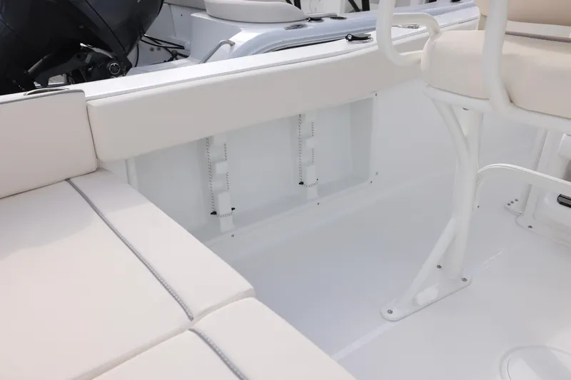 Slide: The Image of Interior view of 2026 Sea Hunt Ultra 219 boat, featuring white seating and sleek design. - 8