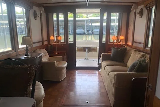 Slide: The Image of Interior of a 1986 Pilgrim 40 boat with cozy seating and elegant decor. - 19