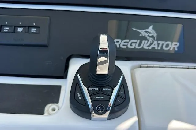 Slide: The Image of Joystick control panel on a 2015 Regulator 34 boat dashboard. - 17