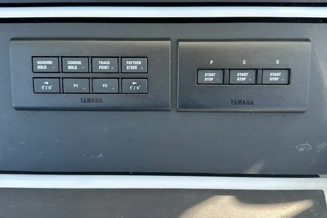 Slide: The Image of Control panel of a 2015 Regulator 34 boat featuring Yamaha navigation and engine controls. - 19