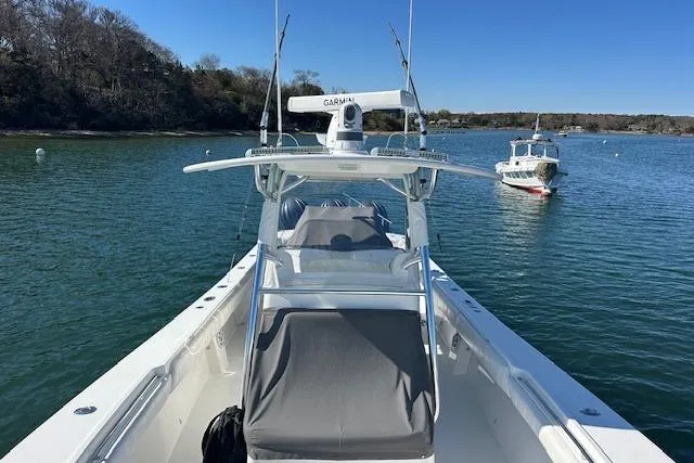 Slide: The Image of 2015 Regulator 34 boat on calm water, featuring a Garmin radar system. - 27