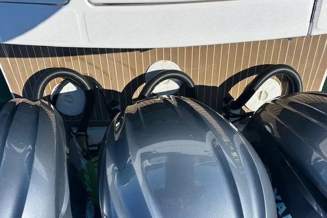 Slide: The Image of 2015 Regulator 34 boat with triple outboard engines, viewed from above. - 32