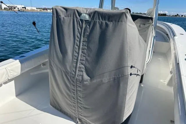 Slide: The Image of 2015 Regulator 34 boat with covered console on calm water. - 41