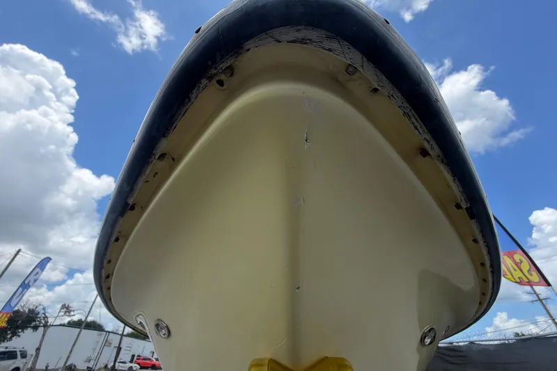 Slide: The Image of 2006 ShearWater 2200Z boat hull against a bright blue sky with clouds. - 11