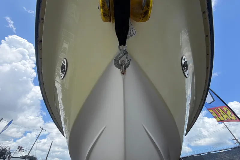 Slide: The Image of 2006 ShearWater 2200Z boat hull, viewed from below, with a clear blue sky background. - 12