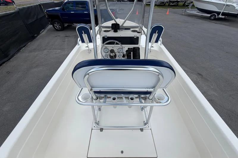 Slide: The Image of 2006 ShearWater 2200Z boat interior with steering console and seating. - 16