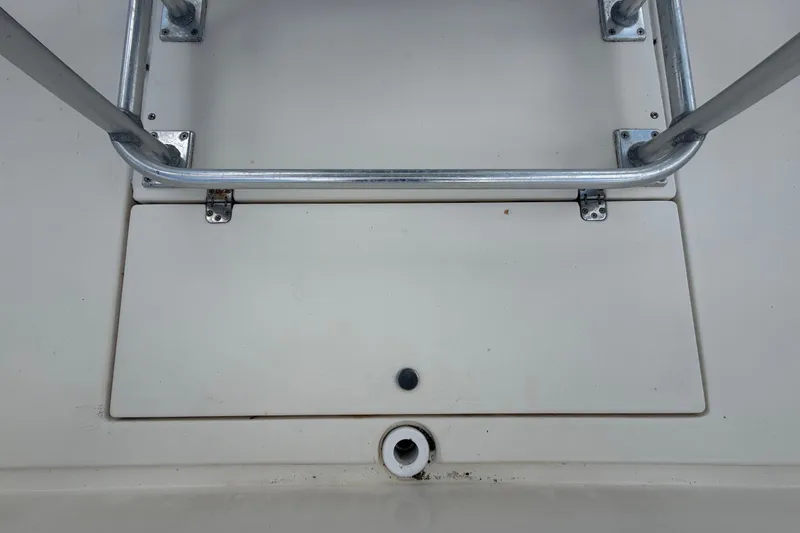 Slide: The Image of 2006 ShearWater 2200Z boat deck with metal railing and hatch. - 17