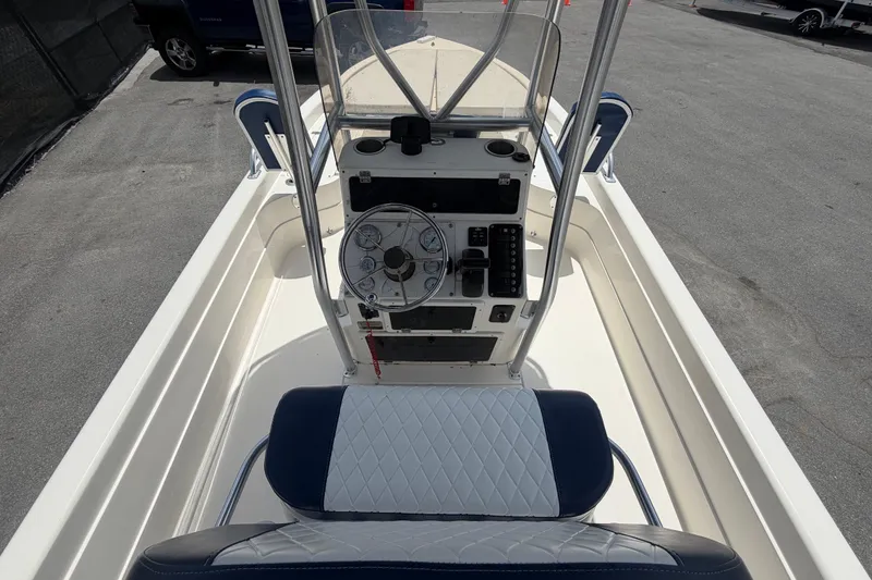 Slide: The Image of 2006 ShearWater 2200Z boat console with steering wheel and seating. - 20