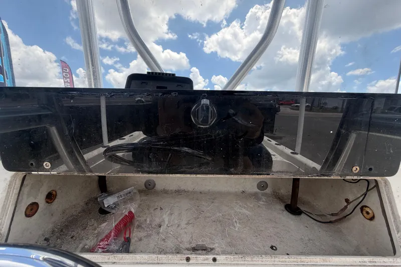 Slide: The Image of Console of a 2006 ShearWater 2200Z boat under a cloudy sky. - 25