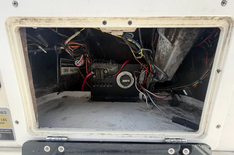 Slide: The Image of Open electrical compartment of 2006 ShearWater 2200Z boat showing wiring and components. - 27