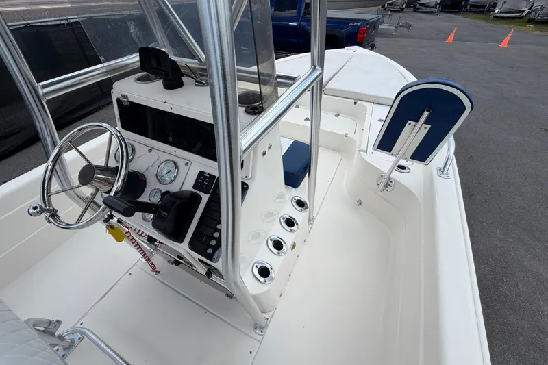 Slide: The Image of 2006 ShearWater 2200Z boat cockpit with steering wheel and control panel. - 30