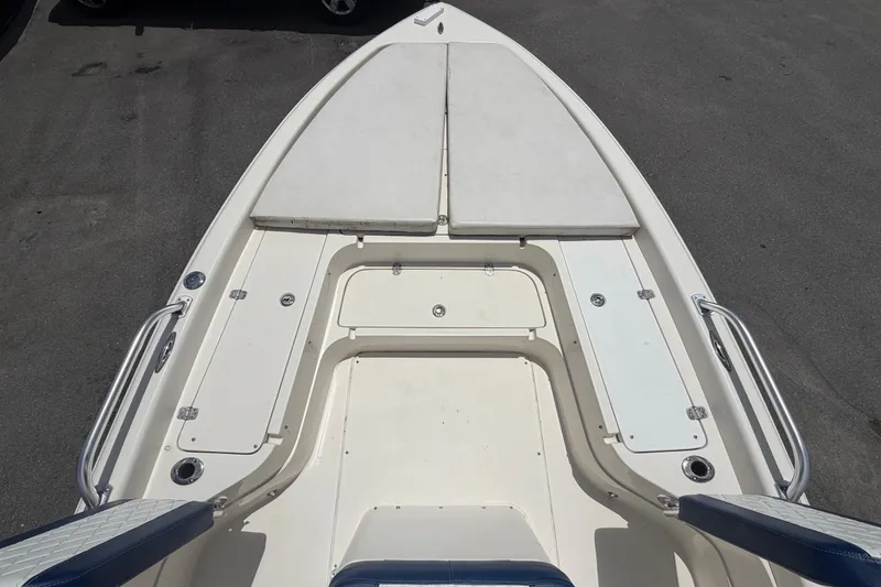 Slide: The Image of 2006 ShearWater 2200Z boat deck with storage compartments and seating. - 31